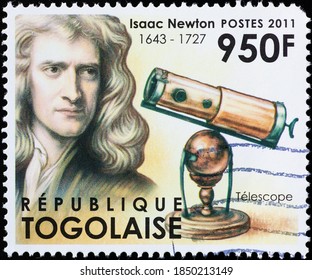 Milan, Italy - October 28, 2020: Isaac Newton And His Telescope On Stamp Of Togo