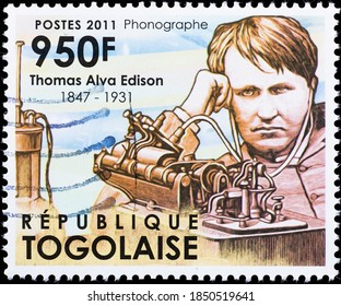 Milan, Italy - October 28, 2020: Thomas Edison And His Phonograph On Stamp Of Togo