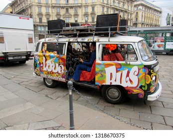 Milan, Italy - October 8, 2016. A Rock Band Tours The City Of Milan Performing In An Old Volkswagen Bus.