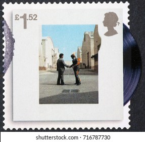 Milan, Italy - September 1, 2017: Cover of Wish you were here by Pink floyd on stamp