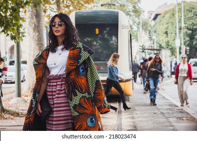 MILAN, ITALY - SEPTEMBER 17: Woman poses outside Gucci fashion shows building for Milan Women's Fashion Week on SEPTEMBER 17, 2014 in Milan.