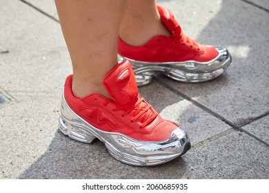 MILAN, ITALY - SEPTEMBER 18, 2019: Man With Raf Simons Red And Silver Sneakers, Street Style 