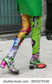 MILAN, ITALY - SEPTEMBER 19, 2019: Woman with colorful trousers and green jacket, street style 