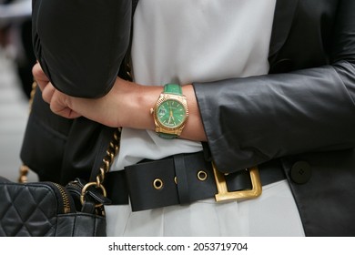 MILAN, ITALY - SEPTEMBER 19, 2019: Woman With Green And Gold Rolex Daydate Watch, Street Style 