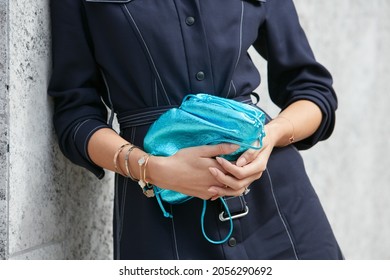 MILAN, ITALY - SEPTEMBER 20, 2019: Woman With Blue Metallic Bag And Blue Dress, Street Style 