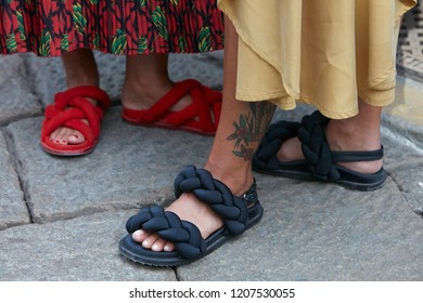 MILAN, ITALY - SEPTEMBER 21, 2018: Woman with black sandals and beige skirt before Blumarine fashion show, Milan Fashion Week street style