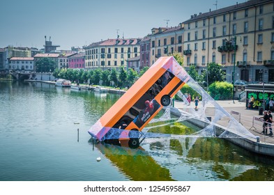 Milan, Italy, September 9, 2018: Bus Partially Immersed In Lake, Fell Into River And Kept On Web, Spiderman Movie Advertising