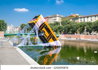 Milan, Italy, September 9, 2018: Bus Partially Immersed In Lake, Fell Into River And Kept On Web, Spiderman Movie Advertising