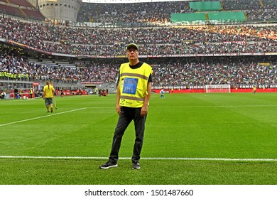 MILAN, ITALY-AUGUST 31, 2019: Security Steward On The Pitch Of The San Siro Soccer Stadium , In Milan.