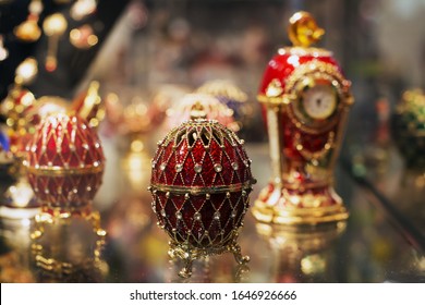 Milan, Italy-December 6,2019 Russian Souvenirs On The Shelf For Sale. Fabergé Style Egg, Egg With Watches With Precious Decorations.
