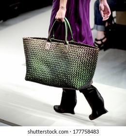 MILAN, ITALY-FEBRUARY 27, 2010: Close Up Of A Model's Green Bag On Runway Catwalk During The Fall-winter Fashion Collection Of Bottega Veneta.