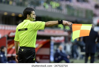 MILAN, ITALY-JANUARY 25, 2015: Soccer Linesman Referee Wave The Flag To Point An Offside, At The San Siro Stadium For The Serie A Match FC Internazionale Vs Torino, In Milan.