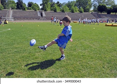 MILAN, ITALY-JUNE 02, 2013: children playing rugby during a sunday morning campus at the Arena stadium, in Milan.