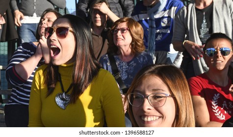 MILAN, ITALY-MARCH 16, 2019: Parents Following And Supporting, A Kids Soccer Match On Tribune, In Milan.