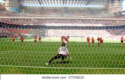 MILAN, ITALY-MAY 16, 2006: Penalty kick view from behind the goal post, during the Italian Serie A soccer match AC Milan vs AS Rome at the San Siro stadium.