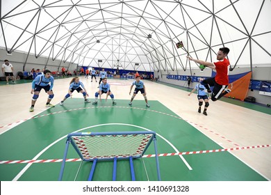 MILAN, ITALY-MAY 26, 2019: tchoukball players action seen behind a tchoukball goal net, during a tchouklball match, in Milan.