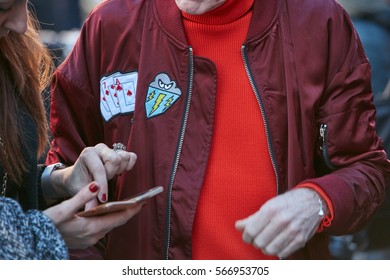 MILAN - JANUARY 16: Man With Dark Red Bomber Jacket And Red Sweater Before Etro Fashion Show, Milan Fashion Week Street Style On January 16, 2017 In Milan.