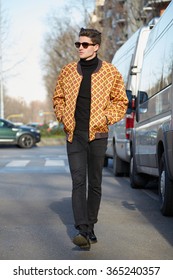 MILAN - JANUARY 19: Man With Yellow Bomber Jacket Poses For Photographers Before Giorgio Armani Fashion Show On January 19, 2015 In Milan, Italy. Man Fashion Fall Winter 2016 / 2017