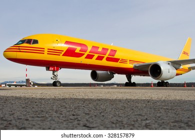 MILAN MALPENSA - FEBRUARY 23, 2015: Boeing 757-200 freight DHL parked on the apron of Malpensa airport.