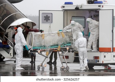 MILAN MALPENSA - NOVEMBER 12, 2014: Ebola emergency simulation in Malpensa. A bogus infected patient has arrived in the airport, and then carried to "Sacco Hospital" by a special modified ambulance.