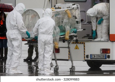 MILAN MALPENSA - NOVEMBER 12, 2014: Ebola emergency simulation in Malpensa. A bogus infected patient has arrived in the airport, and then carried to "Sacco Hospital" by a special modified ambulance.