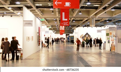 MILAN - MARCH 27: People walk through work of arts galleries during MiArt ArtNow, international exhibition of modern and contemporary art March 27, 2010 in Milan, Italy.