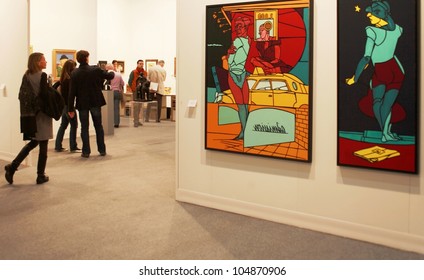 MILAN - MARCH 27: A woman enters paintings galleries during MiArt ArtNow, international exhibition of modern and contemporary art March 27, 2010 in Milan, Italy.