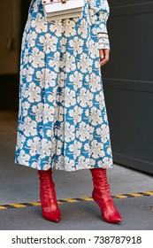 MILAN - SEPTEMBER 21: Woman With White And Blue Dress With Floral Design And Red Shoes Before Fendi Fashion Show, Milan Fashion Week Street Style On September 21, 2017 In Milan.