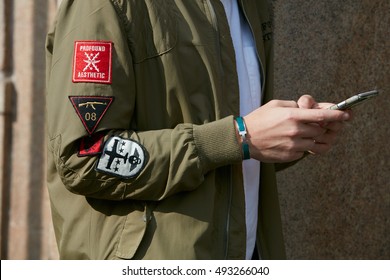 MILAN - SEPTEMBER 23: Man With Hermes Bracelet And Green Bomber Jacket Before Giamba Fashion Show, Milan Fashion Week Street Style On September 23, 2016 In Milan.