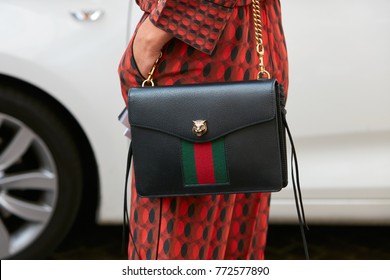 MILAN - SEPTEMBER 23: Woman With Black Leather Gucci Bag With Golden Lion Head And Red Dress Before Antonio Marras Fashion Show, Milan Fashion Week Street Style On September 23, 2017 In Milan.
