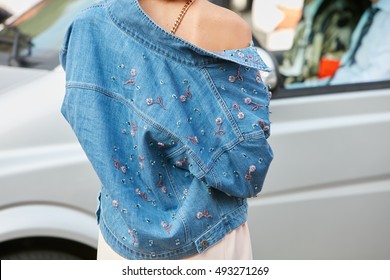 MILAN - SEPTEMBER 23: Woman With Blue Jeans Jacket With Flowers Decoration Before Fashion Tod's Show, Milan Fashion Week Street Style On September 23, 2016 In Milan.