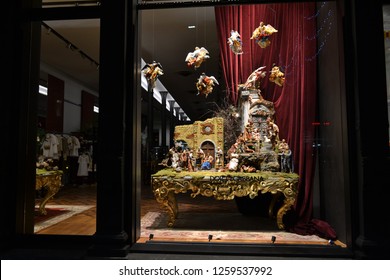 Milan/Italy - December 31, 2015: Close-up view to the Dolce & Gabbana boutique window decorated for Christmas holidays with original Neapolitan creche figures of 18th century. - Shutterstock ID 1259537992