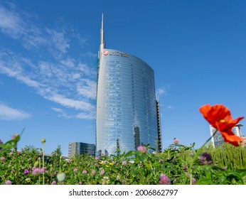 Milano, Italy. July 08, 2021. The iconic Unicredit tower and the BAM public park. Skyscraper which is part of a group of residential and business buildings. People at the park