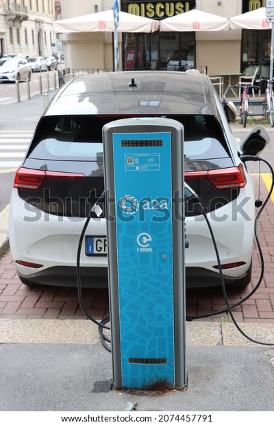 Milano - Italy - November 10, 2021. Electric car\
in charge in Milan city centre.\
