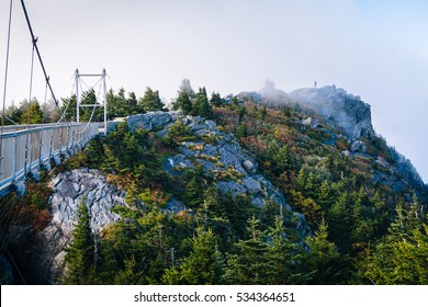 The Mile High Swinging Bridge and rocky summit in fog, at Grandfather Mountain, North Carolina.