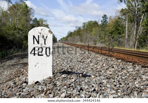 Mile marker 420 on the former rail line running between
New York City and Buffalo, NY. This line has been in place since
the early 1900s. No information on how long this marker has been in
place. 