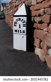 A Mile Marker On A Road Outside A New Housing Estate On The Outskirts Of Penrith Cumbria United Kingdom Showing 1 Mile To Penrith