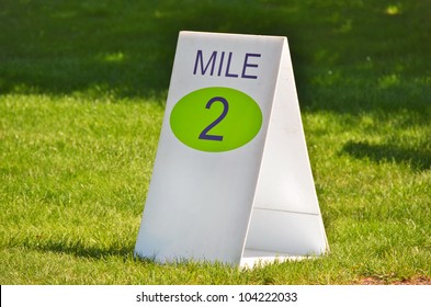 Mile Marker Sign On Grass