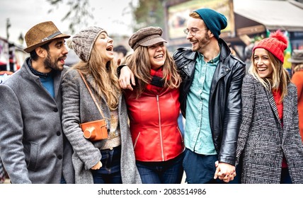 Milennial Students Group Walking At Europe City Center - Next Gen Life Style Concept On Multicultural Young People Wearing Winter Fashion Jackets Having Fun Together Outdoors - Bright Vivid Filter