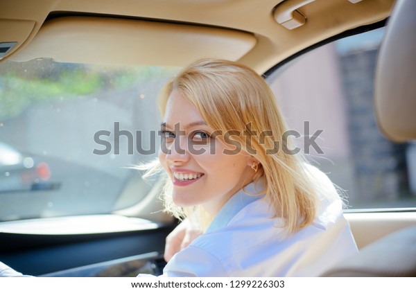 Miles to a better future. Sexy woman enjoy\
traveling by road transport. Eco friendly and sustainable travel.\
Eco driving is an ecologic driving style. Pretty girl travel by\
automobile transport.