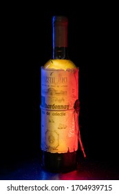 Milestii Mici Winery, Moldova - September 01 2019: Chardonnay Wine Bottle, Vin De Colectie, National Flag Lights. Product Photography