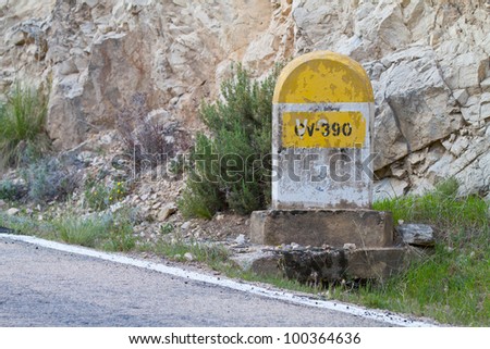 Milestone along an old road in the mountains