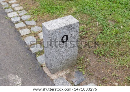 Milestone granite stone marker border sign distance mile kilometer