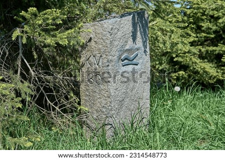 Milestone of kilometer 80 along the Rothaarsteig hiking trail in Sauerland and Siegerland in Germany.