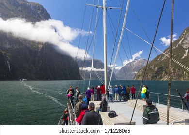 MILFORD SOUND, NEW ZEALAND - NOVEMBER 13, 2013 - Tourists Enjoy The Scenery Of Milford Sound From The Deck Of A Cruise Ship