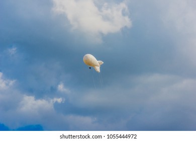 Military Aerostat in a beautiful sky with dramatic clouds