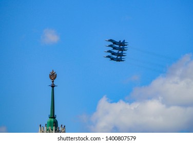 Military Aircraft Above The High-rise Building