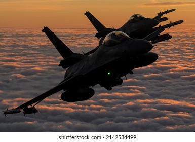 Military aircraft during sunset flying over the clouds