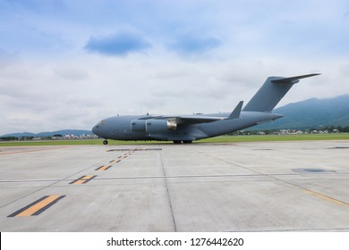 Military Aircraft Landing At A Military Airport.