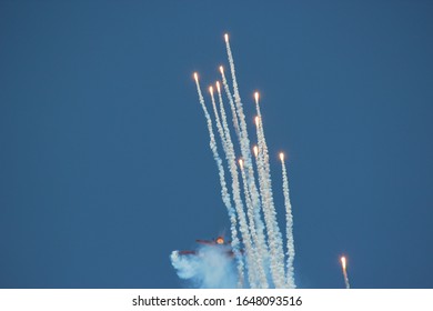 Military Aircraft Shooting Out Flares.